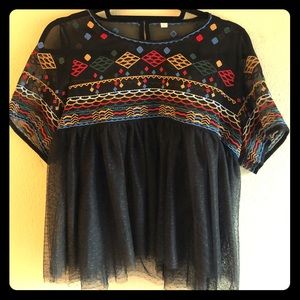 Sheer, embroidered babydoll tulle tunic.